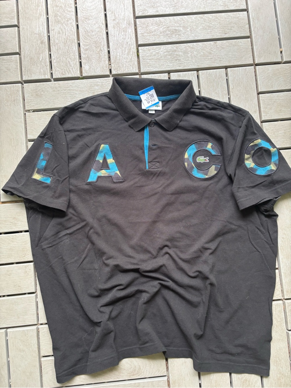Lacoste Black Polo with Blue Camouflage Lettering